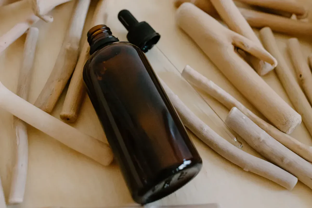 Lumina Skin serum bottle surrounded by fresh botanicals